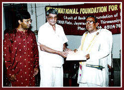 Musicians' Benevolent Fund award being presented to Vairamangalam Lakshminarayanan by T T Vasu.