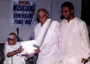 The Musicians' Benevolent Fund award being presented to veteran vocalist Kumaraswami Iyer by Semmangudi Srinivasa Iyer in 1998.